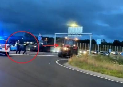 Vaizdo įrašo stop kadras, iš kurio matyti, kad policininkai iš pradžių nusitaikė į traktorių, o vėliau buvo paleistas mažiausiai vienas šūvis į techniką.